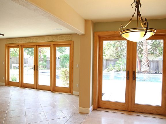Dual French doors Leading to Patio and Pool