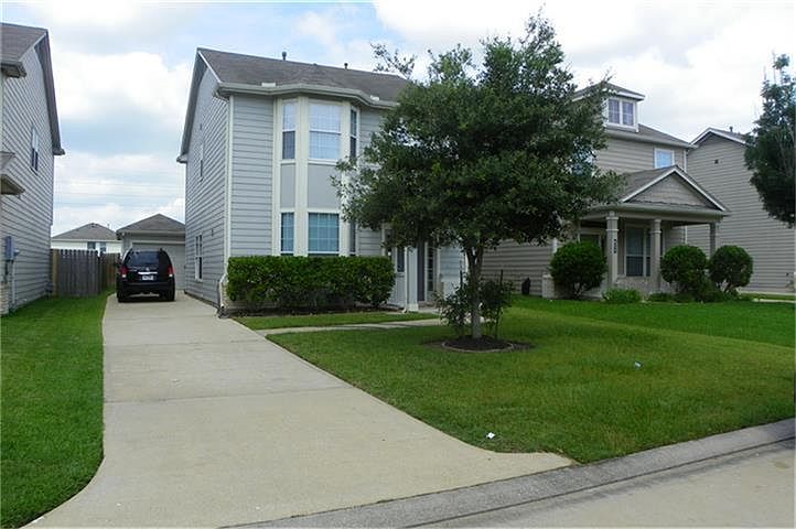 Welcome home to this updated home in Katy with fresh paint, new carpet, and tile floors on main floo