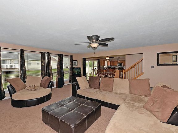 Expansive family room that is open to the breakfast room and kitchen.  Floor to ceiling windows add lots of natural lightening a