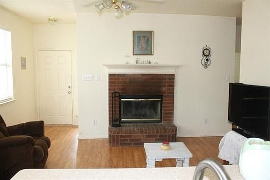 Living room fireplace and wood floor