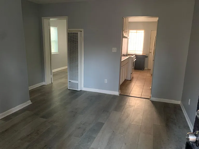 Entrance, living room, kitchen on right, bedroom on left