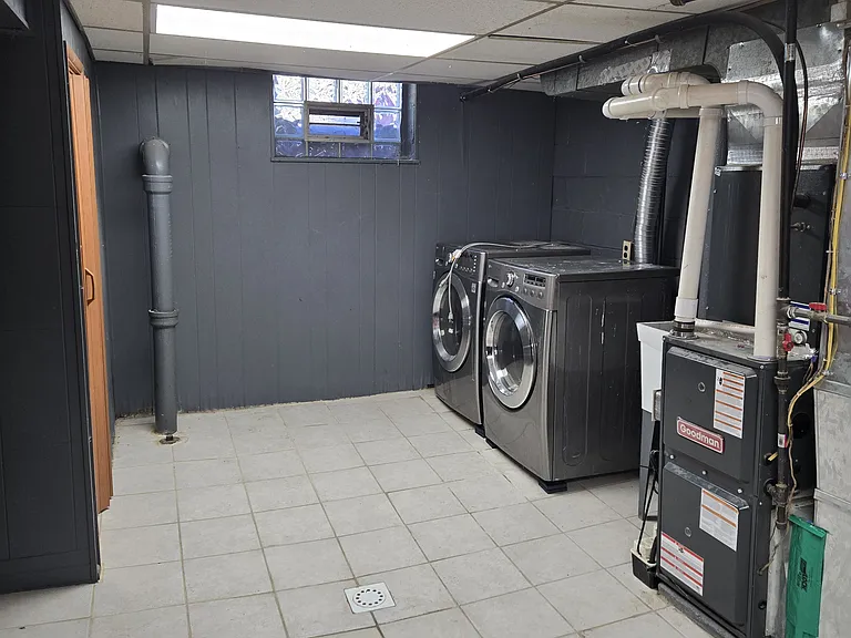 Basement with dryer and washer.