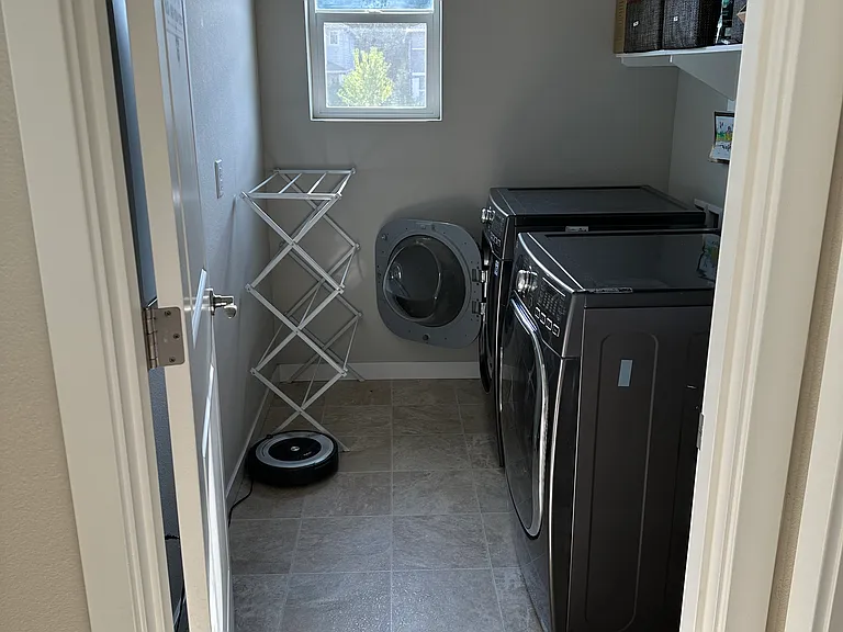 Laundry room with washer and dryer