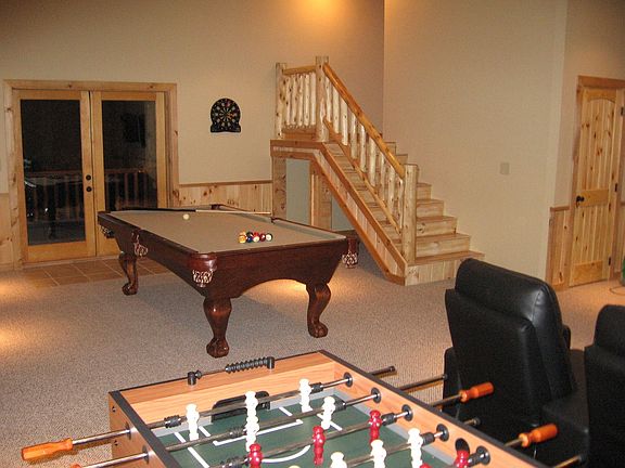 Basement w/ pool table,foosball, plasma tv, theater seating, pub table.  