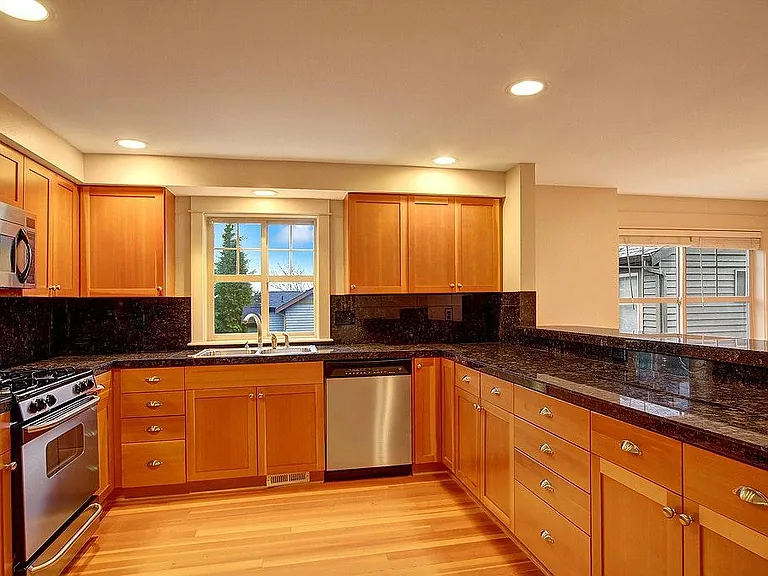 Large kitchen with modern stainless steel appliances