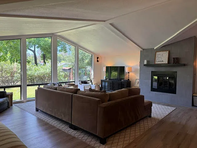open living room, gas fireplace, 58" TV