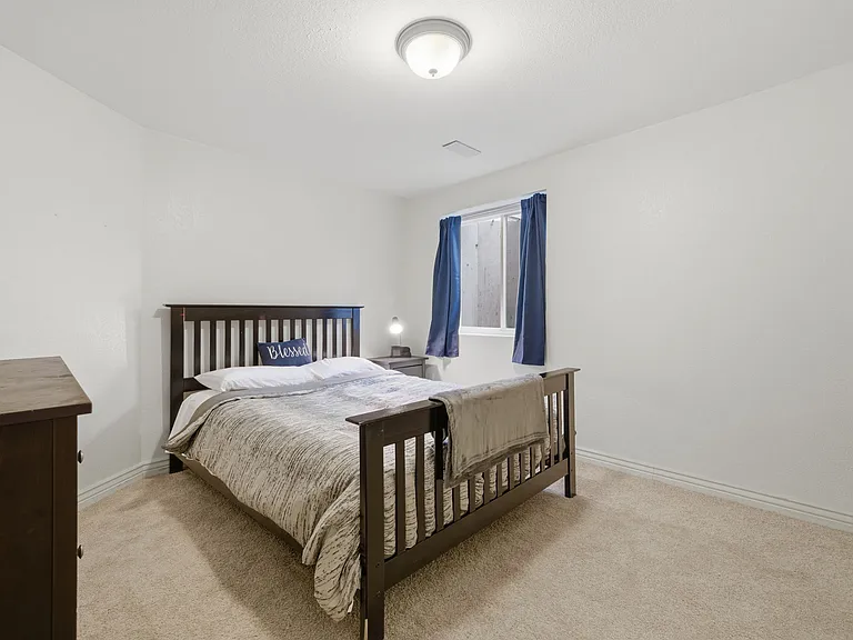 Private bedroom with storage and queen bed