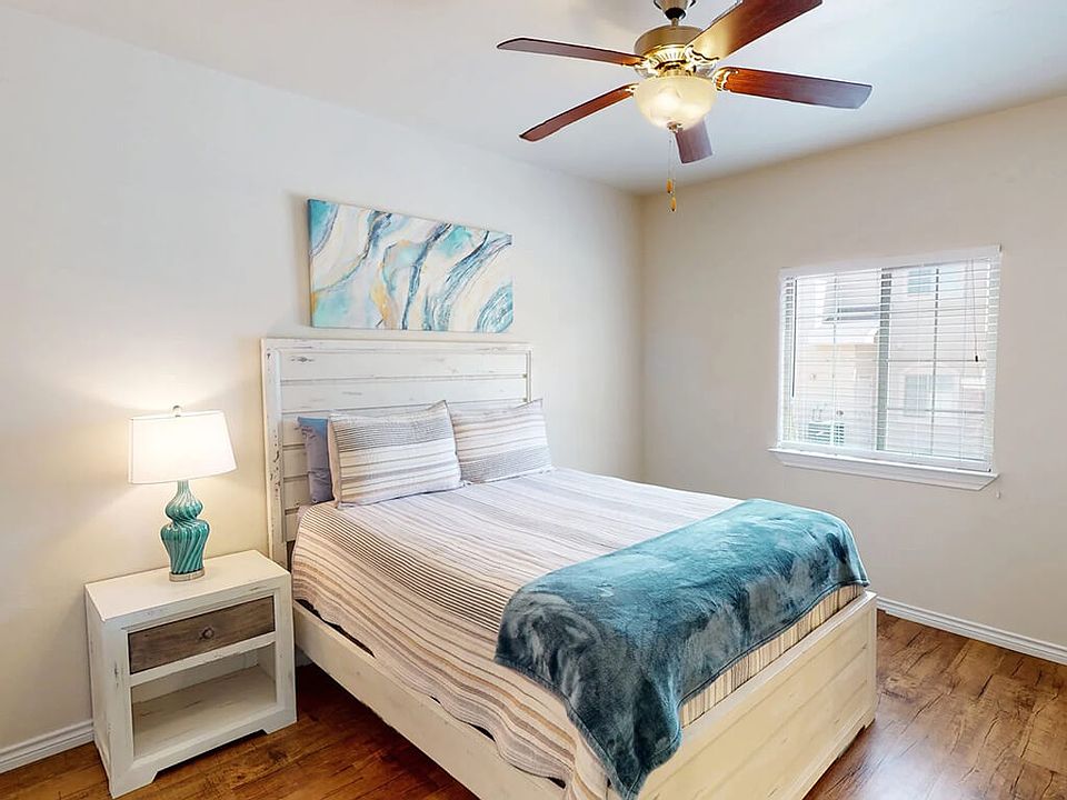 Bedroom with Ceiling Fan and Overhead Light