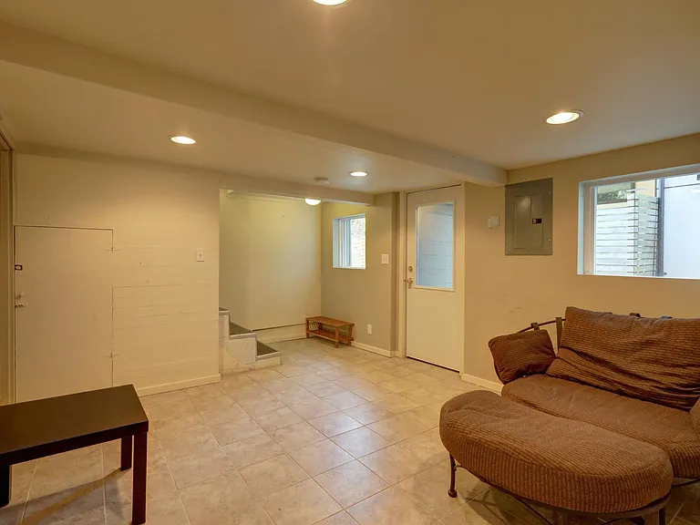 Lower level sitting area with backyard access. House is pet friendly!