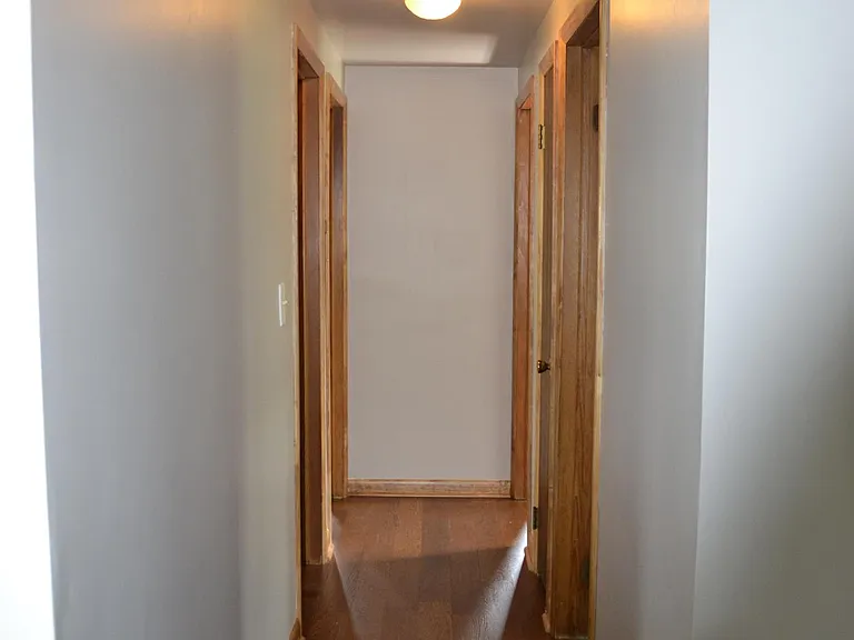Hallway to bedrooms, office space, and bath.