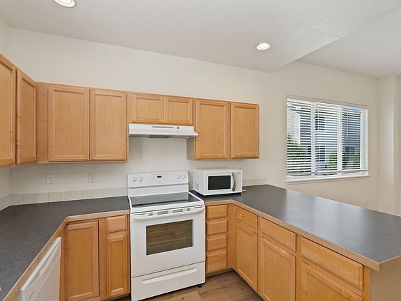 Appliances include - Refrigerator, Oven, Microwave, and Dishwasher