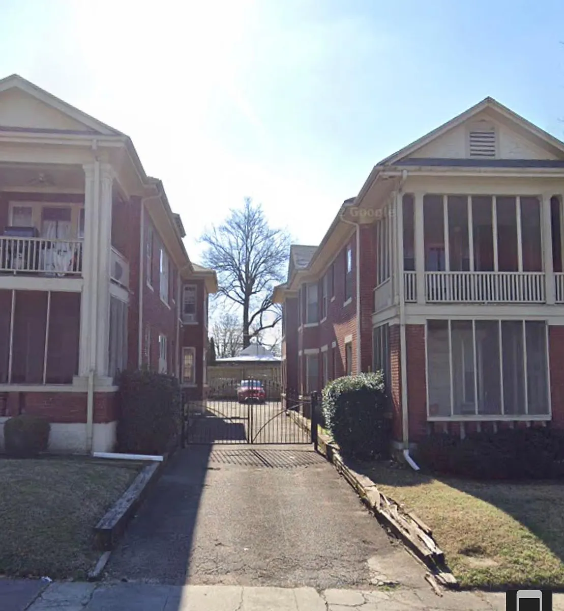 Gated driveway to reserved parking area. - 1199 Vance Ave #3