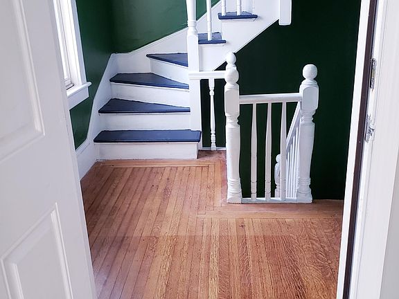 Hardwood floor outside of second floor doorway