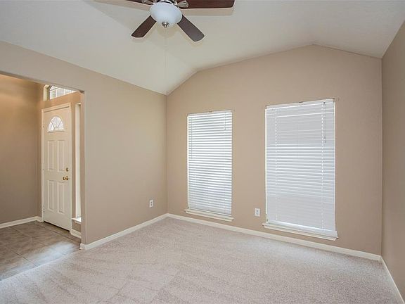 Home has formal dining room, updated fan, new paint and new carpet!
