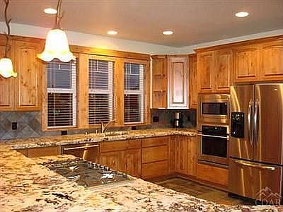 Kitchen has granite, stainless appliances, etc