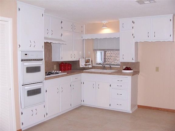 Fresh paint and new hardware and plenty of room for dining in this large kitchen.