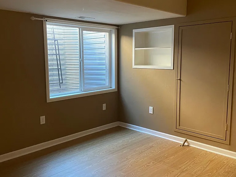 Basement bedroom - now painted white