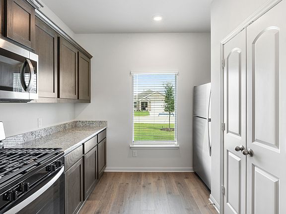 The kitchen has energy-efficient appliances.