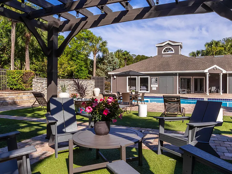 Enjoy a shady escape under our stylish pergolasperfect for unwinding, reading, or catching up with friends just steps from the pool.