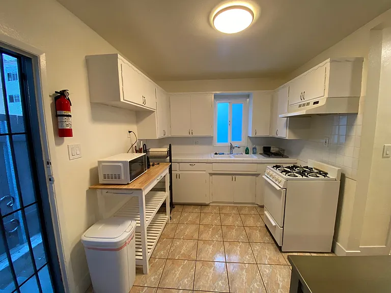 2 Bedroom: Kitchen with Gas stove, full size refrigerator, microwave, disposal and other kitchen essentials