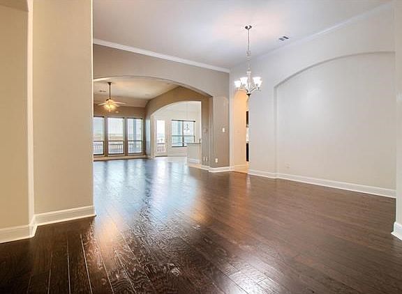 The foyer opens to the fromal dining & living areas.