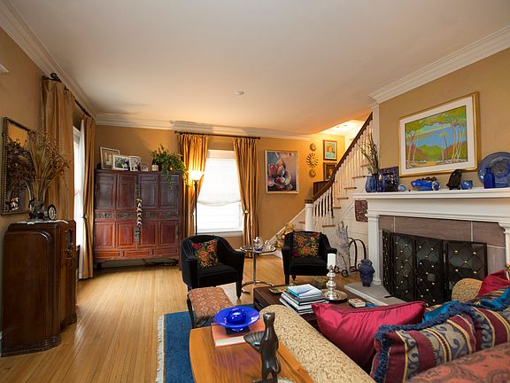 Formal Living Room is large enough for multiple seating areas.  One side of the split staircase opens to this room.