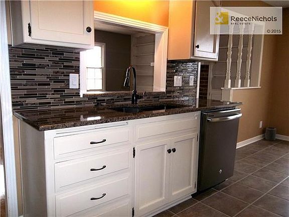 Kitchen with new Granit Countertops, Backsplash, Dishwasher and Faucet.