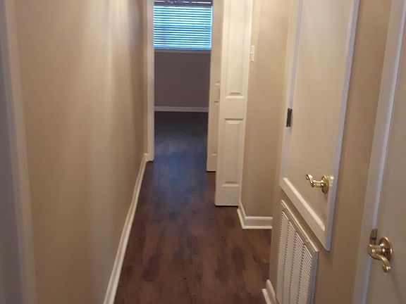 Hallway with laundry closet and linen closet.