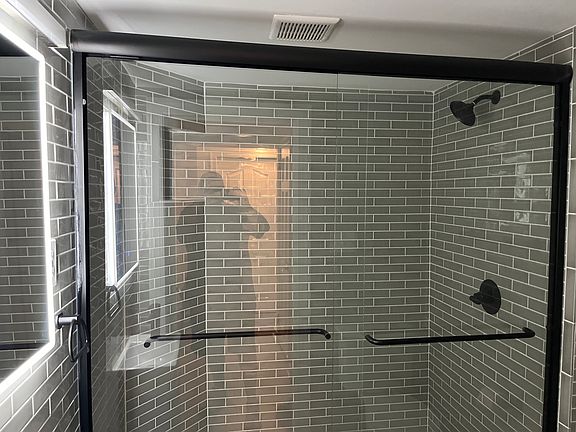 The old walls and floor were completely removed to create this very contemporary bathroom.