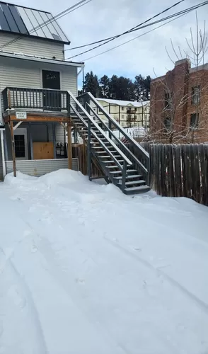 Stairs up to the office space - 815 W Main St #BACK ENTRANCE