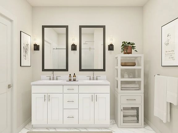 Primary bath features vanity with dual sinks