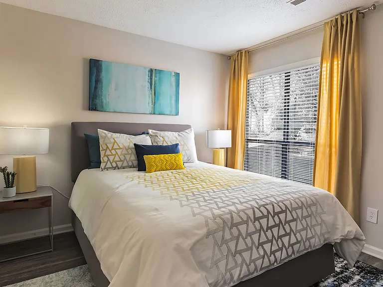Bedroom featuring Accent Wall and Large Window for Natural Light - Diamond Interior