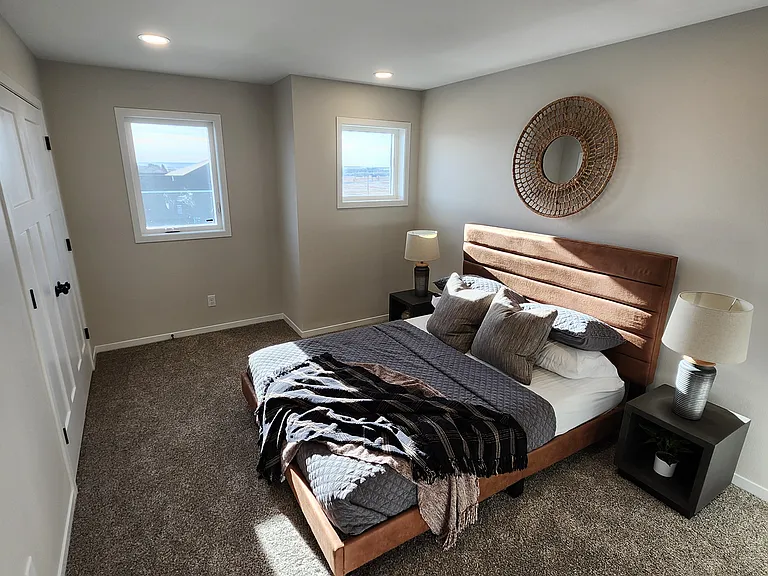 Bedroom three. (Pictures are of another unit with similar finishes and features.)