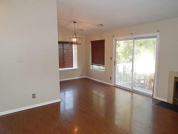 Living Room and Dining Room combo. Laminated floors.