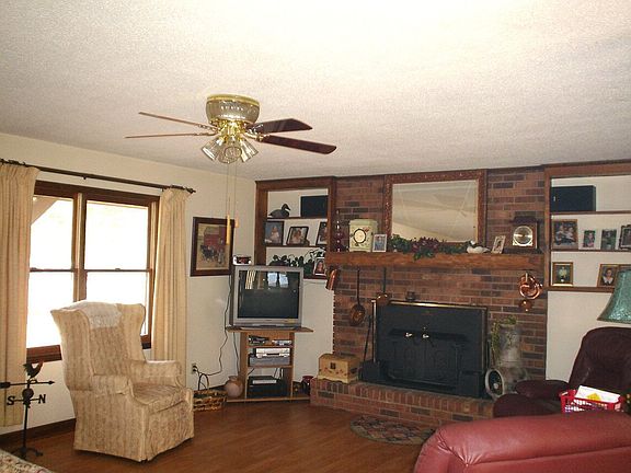 Comfortable Family Room with a Wood Burning Brick Fireplace