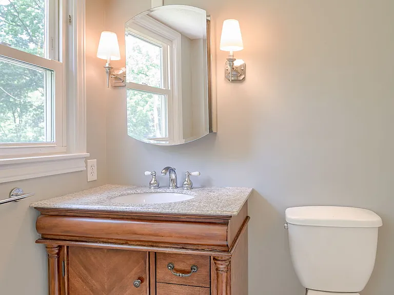 Bathroom2: Master bathroom features window overlooking the backyard, nice vanity + shelved mirror, large toilet