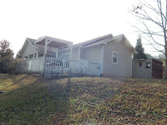 Image 2: House from lower property line by woods