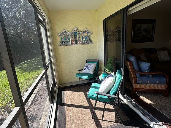 Spacious downstairs porch looking out over the water and bird sanctuary.