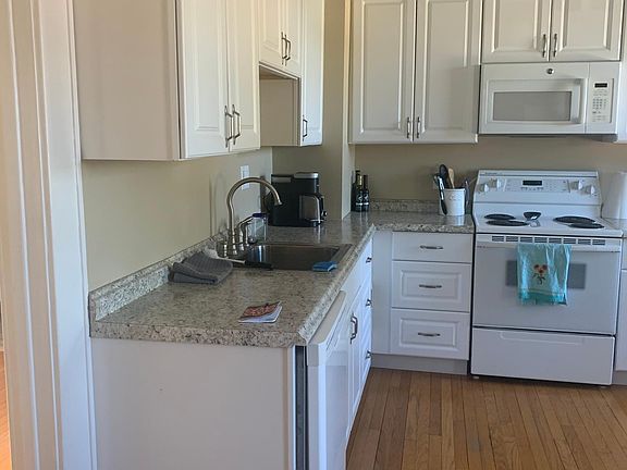 Entrance from back of house into large kitchen