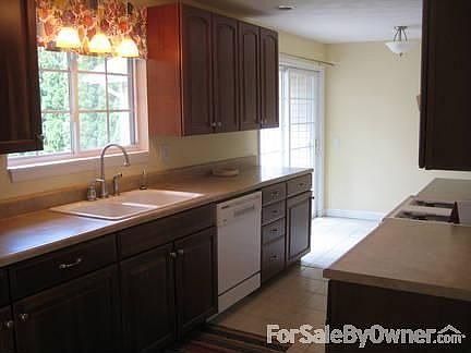 Kitchen
						:
						New cherry cabinets and tile floor