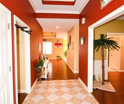 Entryway into dining room on the right and 2 bedrooms hallway on your left.