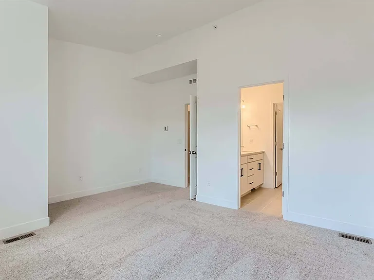 First bedroom with ensuite bath and walk-in closet