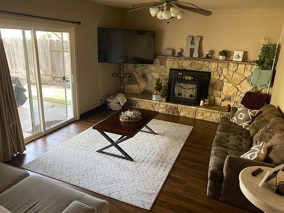 Living room with fireplace and sliding door to covered porch