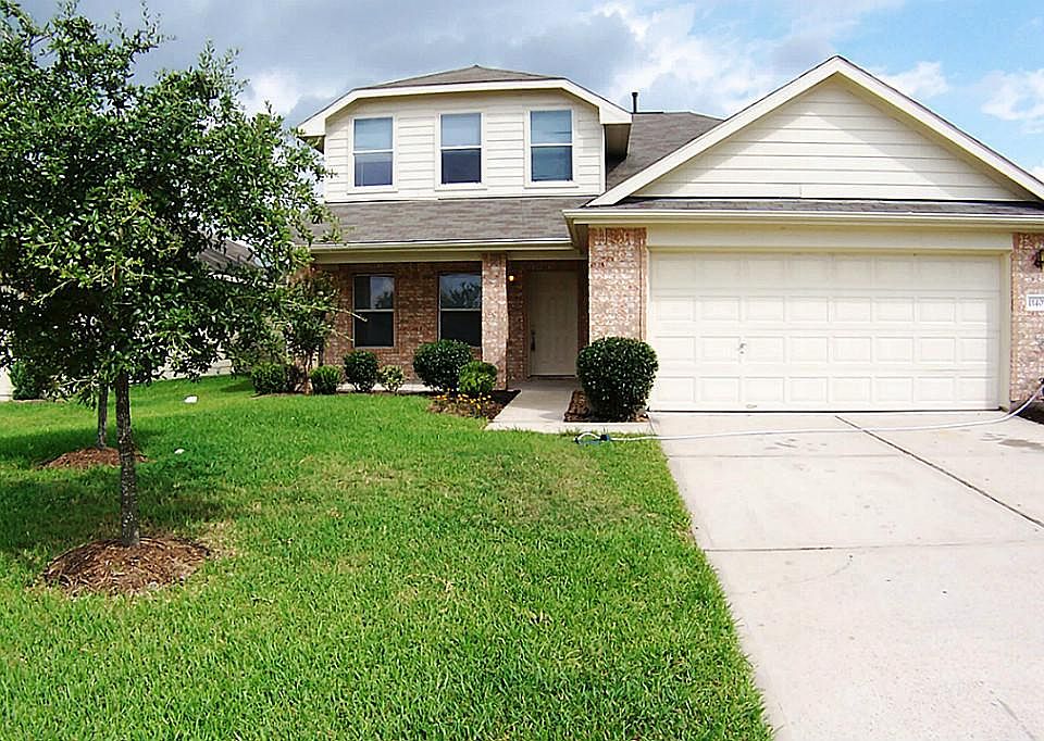 street view with 2 nice live oaks and new landscaping.