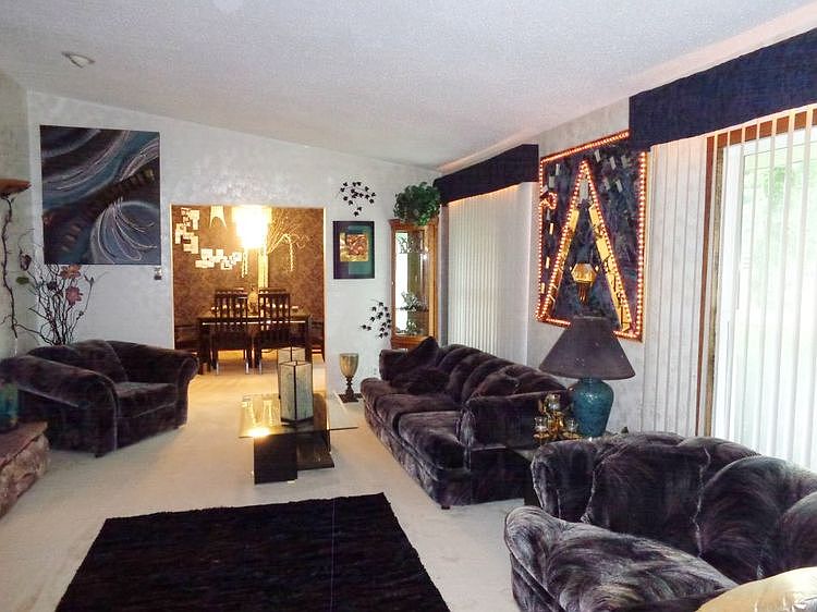 Formal living room with vaulted ceiling.