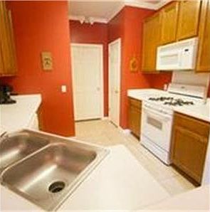 Kitchen open to family room, gas stove and built in microwave.