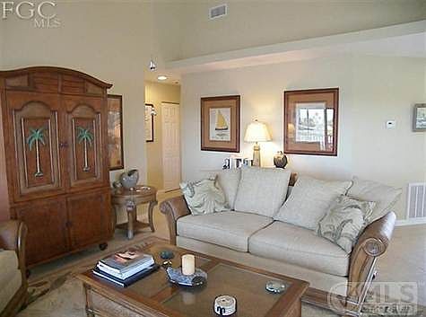 Sit on the sofa and enjoy watching pelican fly by and dolphin play.