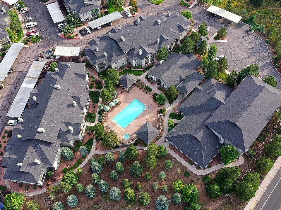 Experience upscale living in this beautifully landscaped apartment community, featuring a pristine swimming pool.