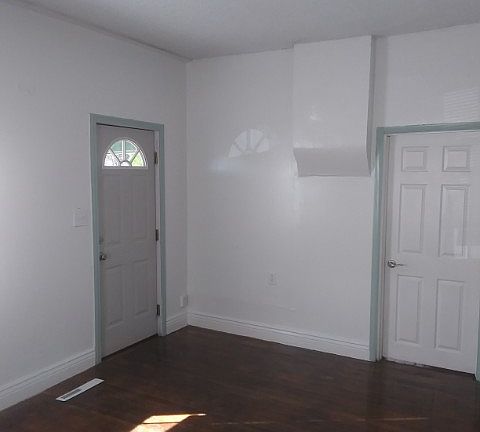 Front door on the left, and northwest bedroom on the right of the photo