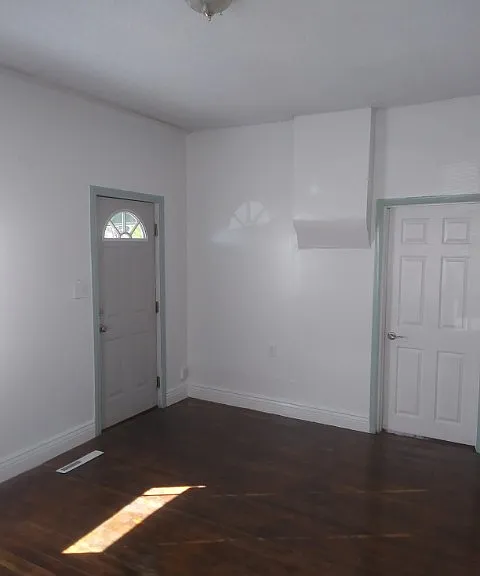 Front door on the left, and northwest bedroom on the right of the photo